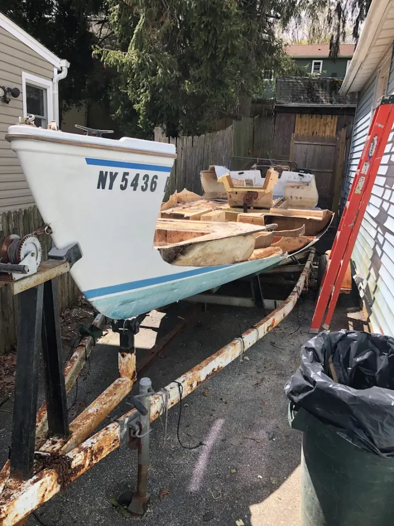 Demolition and removal of a sailboat from driveway